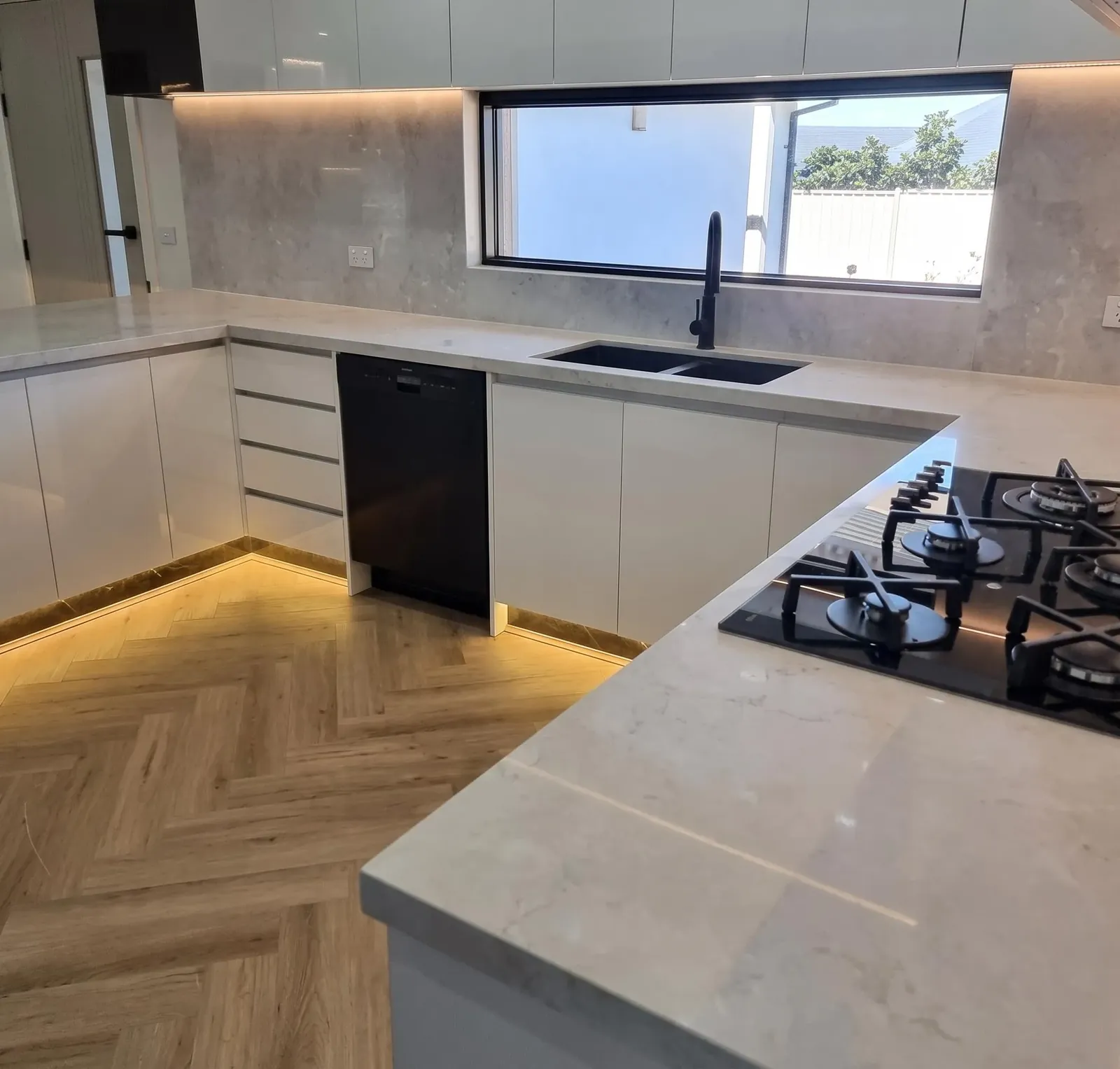 Grey stone kitchen with LED strip lighting