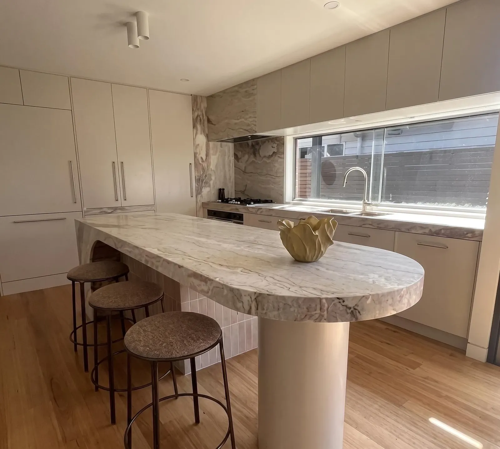 Curved island benchtop on a pedestal base